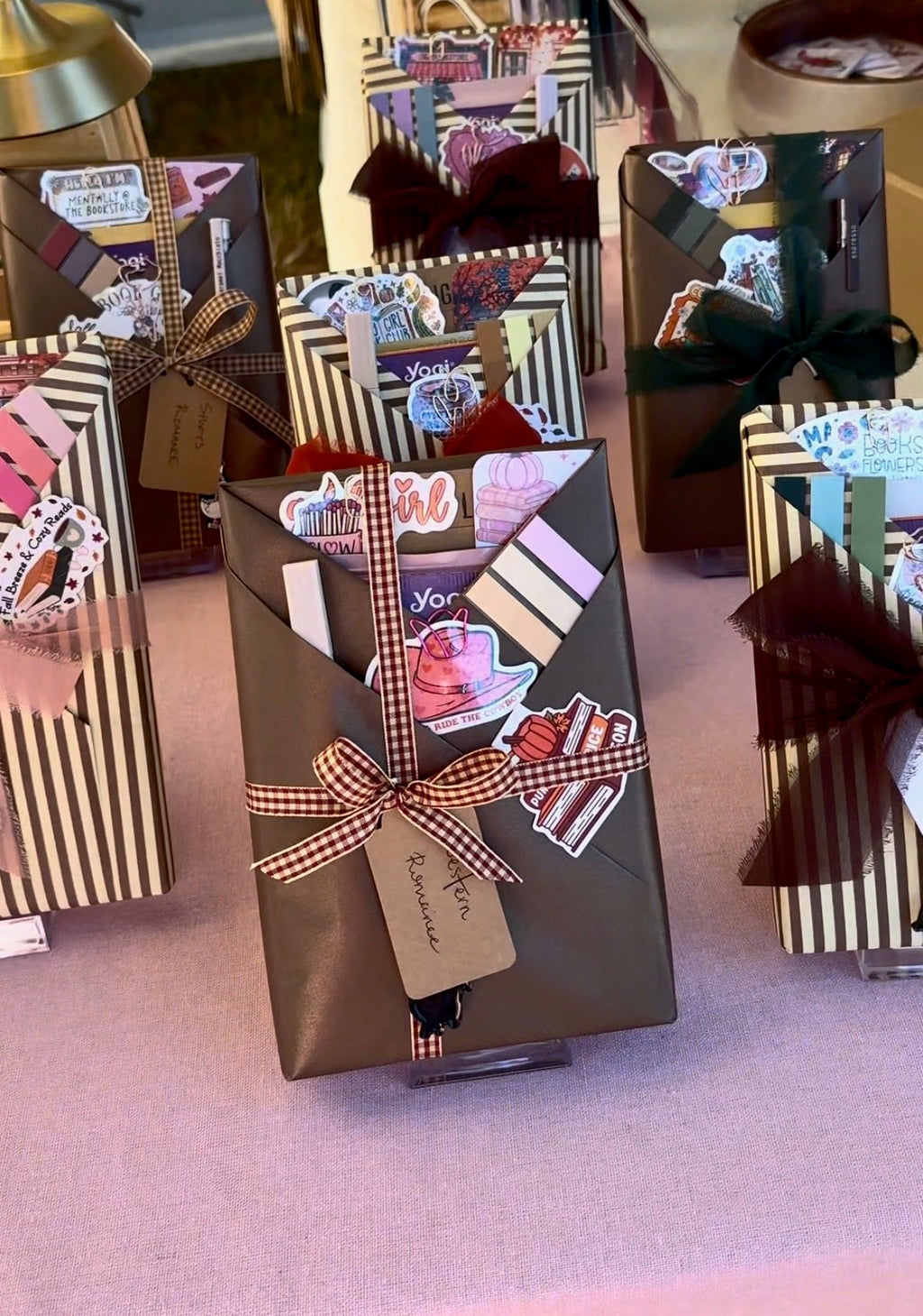 Wrapped blind date books with ribbons and reading-themed extras displayed together
