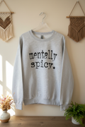 Mentally Spicy sweatshirt on clear hanger